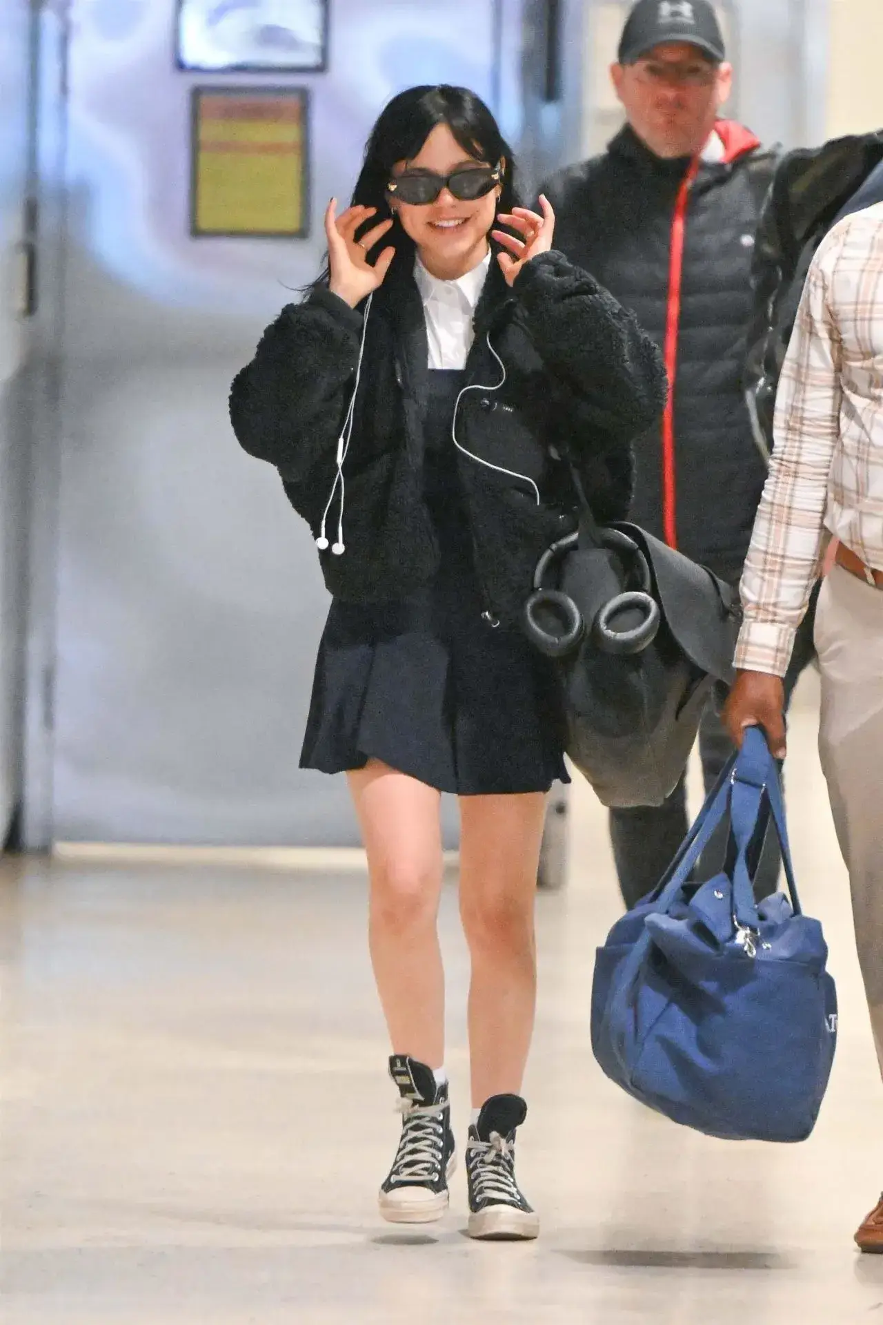 American actress Jenna Ortega Stills in Blue dress at JFK Airport